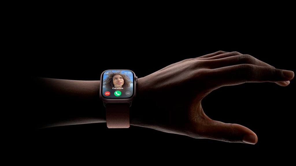 Double tap of the Apple Watch a picture of a Apple Watch on the wrist with a hand and fingers about to double tap