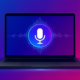 Illustration of a dark grey MacBook on a vibrant blue and purple gradient background, showing a glowing microphone icon with glitch effects on screen to represent Voice Control bugs.
