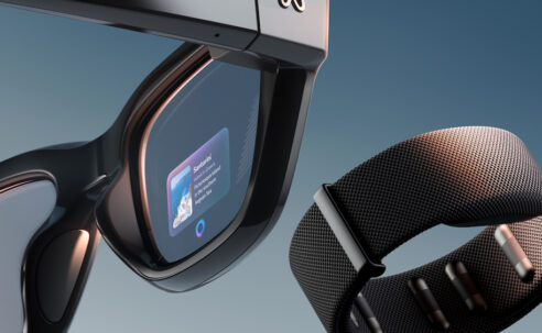 Meta Ray-Ban Display smart glasses and Neural Band wristband shown together, highlighting the new in-lens display and subtle gesture control features.