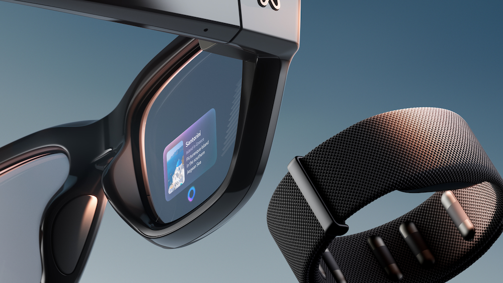 Meta Ray-Ban Display smart glasses and Neural Band wristband shown together, highlighting the new in-lens display and subtle gesture control features.