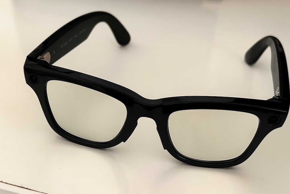 Close-up of Ray-Ban Meta smart glasses Gen 2 with black frames placed on a white surface