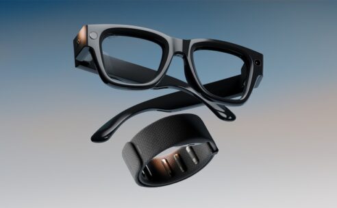 A product shot of the Meta Ray-Ban Display glasses and the Meta Neural Band, which work together as a system, shown against a gradient background