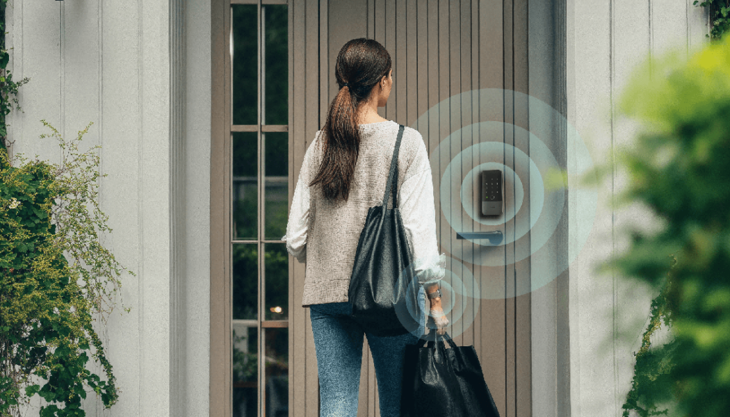Person approaching a front door with an Aqara smart lock, illustrated with wireless proximity rings to show hands-free unlocking using Ultra Wideband technology.