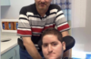 Wael Tarabishi, a disabled man using a wheelchair and breathing tube, sits in a hospital room with his father and full-time carer, Maher Tarabishi, standing behind him.