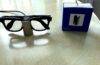 Meta Glasses Charging Stand review image with Ray-Ban Meta smart glasses charging beside the retail box