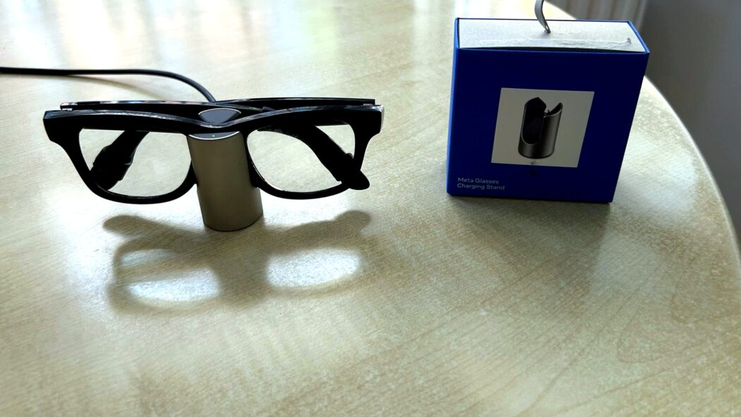Meta Glasses Charging Stand review image with Ray-Ban Meta smart glasses charging beside the retail box