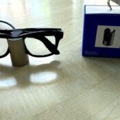 Meta Glasses Charging Stand review image with Ray-Ban Meta smart glasses charging beside the retail box