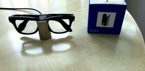 Meta Glasses Charging Stand review image with Ray-Ban Meta smart glasses charging beside the retail box