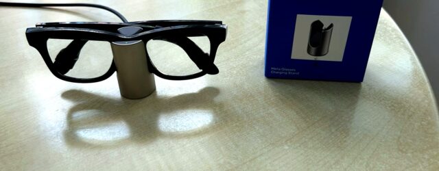 Meta Glasses Charging Stand review image with Ray-Ban Meta smart glasses charging beside the retail box