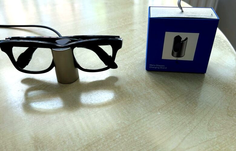 Meta Glasses Charging Stand review image with Ray-Ban Meta smart glasses charging beside the retail box