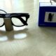 Meta Glasses Charging Stand review image with Ray-Ban Meta smart glasses charging beside the retail box