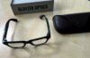 Ray-Ban Meta Blayzer Optics smart glasses on a table with charging case and box for a Ray-Ban Meta Blayzer Optics review.