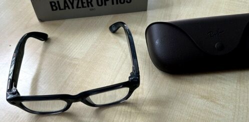 Ray-Ban Meta Blayzer Optics smart glasses on a table with charging case and box for a Ray-Ban Meta Blayzer Optics review.