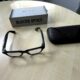 Ray-Ban Meta Blayzer Optics smart glasses on a table with charging case and box for a Ray-Ban Meta Blayzer Optics review.