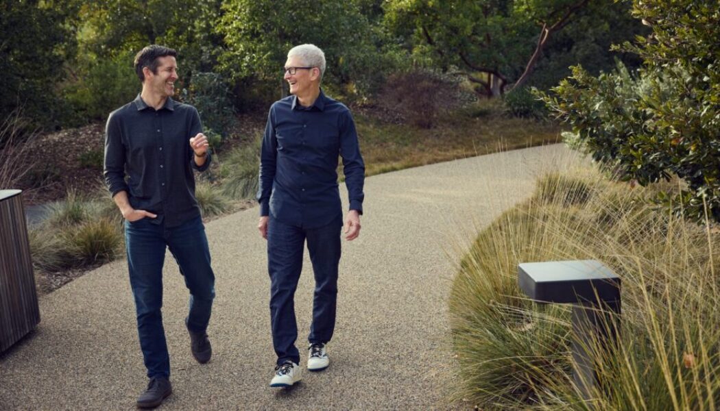Tim Cook and John Ternus walking together at Apple Park in April 2026