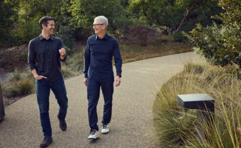 Tim Cook and John Ternus walking together at Apple Park in April 2026