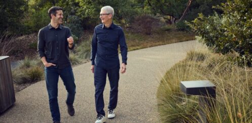 Tim Cook and John Ternus walking together at Apple Park in April 2026