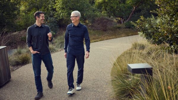 Tim Cook and John Ternus walking together at Apple Park in April 2026
