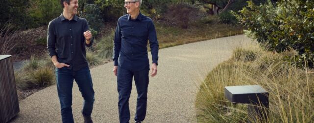 Tim Cook and John Ternus walking together at Apple Park in April 2026