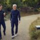 Tim Cook and John Ternus walking together at Apple Park in April 2026