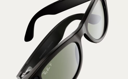 Black Ray-Ban Meta smart glasses shown at an angle, with built-in camera and tinted lenses.